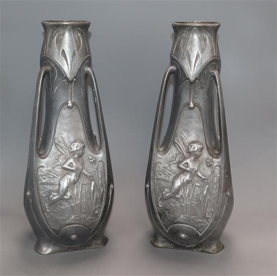 A pair of pewter Art Nouveau vases, signed J.Garnier height 38cm